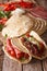 Tasty Italian piadina stuffed with ham, cheese and vegetables cl