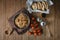 Tasty Italian spaghetti pasta with mussel, tomato, whole wheat bread and garnish on round dish and wooden plate for serving