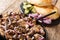 Tasty Jerusalem mixed grill or meorav Yerushalmi served with pita and pickles close-up on a plate. horizontal