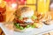 Tasty Juicy American Beef Burger Menu With Lettuce, Ketchup And Potato Chips In Fast-Food Restaurant