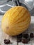 Tasty and juicy melon on a white vintage wooden background. Near ripe dates fruit. Close-up