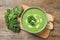 Tasty kale soup served on wooden table