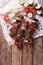 Tasty kebab with vegetables on skewers close-up. Vertical top vi