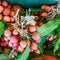 Tasty litchis with leaves background