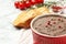 Tasty liver pate with pepper in bowl on table, closeup. Space for text