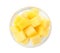 Tasty mango cubes in glass bowl isolated, top view