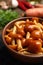 Tasty marinated mushrooms in bowl on table, closeup