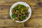 Tasty marrows in soy sauce on wooden table. Top view