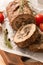 Tasty Meatloaf with mushrooms on wooden table