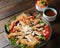 Tasty mouthwatering salad with chicken and vegetables