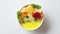 Tasty orange fresh smoothie or yogurt served in bowl. With raspberries, orange slices, chia seeds