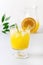 Tasty Orange Juice in Glass With Ice Cube Blue and White Background Fresh Oranges Vertical