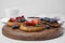 Tasty organic rusks and crispbreads with toppings on light grey table, closeup