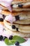 Tasty Pancake with blueberries and berry butter cream vertical