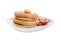 Tasty pancakes with fried bacon and butter on white background