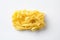 Tasty pasta shape reginelle on white. Isolated. View from above.