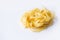 Tasty pasta shape reginelle on white. Isolated. View from above