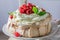 Tasty Pavlova cake with berries and cream