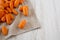 Tasty peeled baby carrots on cloth, side view. Copy space and text area