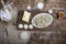 Tasty pelmeni or manti on wooden background with eggs, flour, butter