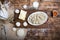 Tasty pelmeni or manti on wooden background with eggs, flour, butter