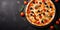 Tasty pepperoni pizza on black background, delicious hot pizza and cooking ingredients, copy space, top view, copy space, top view