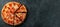 Tasty pepperoni pizza and cooking ingredients tomatoes basil on black concrete background. Top view of hot pepperoni