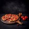 Tasty pepperoni pizza on wooden board over black dark background, text copy space, banner design