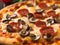 tasty pepperoni pizza on wooden table, closeup