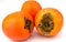 Tasty persimmons kaki fruit on white background