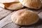 Tasty pita bread on the wooden table closeup horizontal