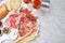 Tasty prosciutto served on light grey marble table. Space for text