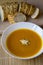 Tasty pumpkin soup with horseradish and fresh multigrain baguette