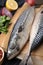 Tasty salted mackerels on table, closeup view