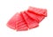 Tasty sashimi (pieces of fresh raw tuna) on white background