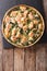 Tasty Savory Tart with salmon and spinach in the dish for baking