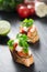 Tasty savory tomato Italian bruschetta, on slices of toasted baguette garnished with parsley