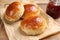 Tasty scones prepared on soda water and jam on wooden table, closeup