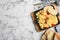 Tasty scrambled eggs served on marble table, flat lay. Space for text