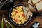 Tasty scrambled eggs served on table, flat lay