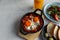 Tasty Shakshouka served on white marble table, above view. Space for text