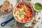 Tasty shakshuka served with fresh wholemeal bread