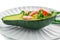 Tasty shrimp salad in avocado boat on plate against white background, closeup