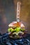 Tasty smoked grilled and glazed beef burger with lettuce, cheese