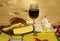 Tasty snacks, glass of wine and Camembert