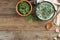 Tasty spinach dip on wooden table, flat lay