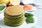 Tasty spinach pancakes on grey marble table, closeup