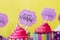 Tasty strawberry cupcakes with Happy Birthday greeting card on y