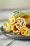 Tasty stuffed pancakes crepes with meat closeup. Thin pancakes with fillings. Russian Fried Stuffed Pancakes Blintzes with Meat