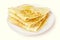 Tasty sweet thin pancakes with honey on plate, delicious dessert, breakfast, closeup, isolated on the white background